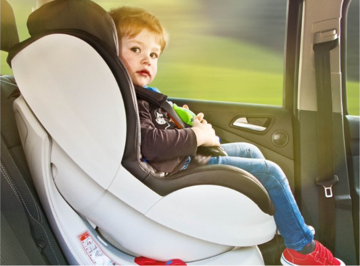 Child travelling in a car seat